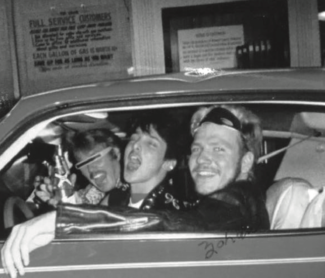 a photo of Jeff and his friends posing for a picture inside of a car